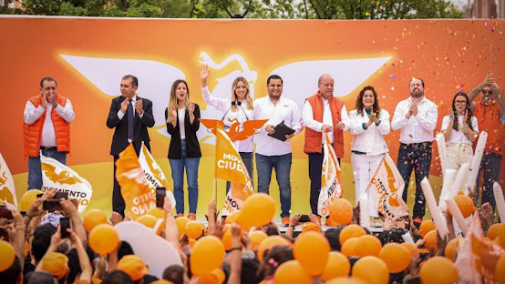 Mariana Rodríguez lidera la apuesta de Movimiento Ciudadano por la alcaldía de Monterrey Imagen abstracta con colores vibrantes y formas.